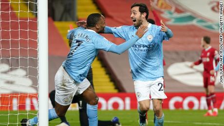 Sterling celebrates with Silva after scoring City&#39;s third goal.