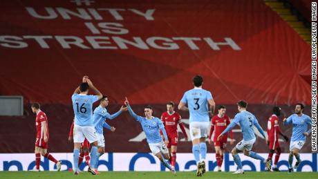 Foden celebrates after scoring Manchester City&#39;s fourth goal against Liverpool.