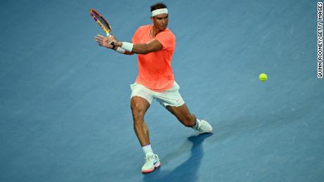 Nadal plays a backhand during his match against Tsitsipas.