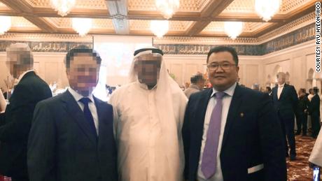 North Korea&#39;s former acting ambassador to Kuwait Ryu Hyeon-woo. CNN blurred the faces of the others in this picture to protect them from possible reprisals.