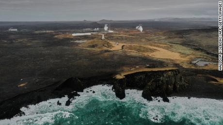 Aerial view taken on February 28, 2021 shows the lighthouse and the geothermal energy plant near the town of Grindavik on the Reykjanes peninsula, Iceland.