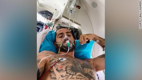 Kemper is pictured on board an emergency medevac flight after surviving a serious accident while surfing in Morrocco in 2020. 