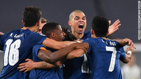 Oliveira celebrates with teammates after scoring their side&#39;s second goal against Juventus.