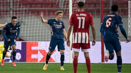 Odegaard celebrates after scoring his team&#39;s first goal against Olympiacos.