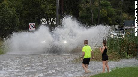 Entire house floats away as flash floods batter Australia&#39;s east coast