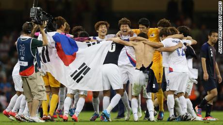 Korea players celebrate after defeating Japan during the men&#39;s bronze medal play-off match between Korea and Japan at the London 2012 Olympics.