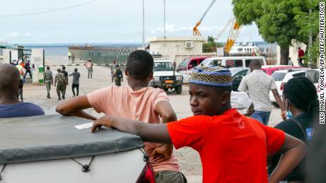 People in Pemba, Mozambique await the arrival of more ships from Palma as people flee attacks by rebel groups on March 29.