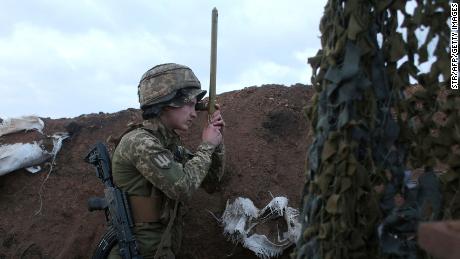 A Ukrainian serviceman uses a periscope in a trench on the frontline with Russia-backed separatists near the town of Zolote, in the Lugansk region on April 8.