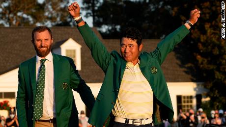 Matsuyama puts on the champion&#39;s Green Jacket after winning the Masters.