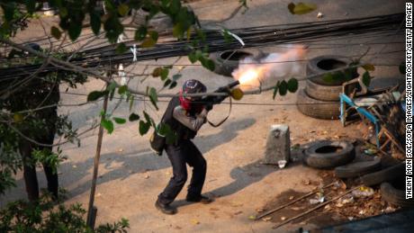 Myanmar police seen shooting a 38 mm grenade launcher at  protesters during a demonstration against the military coup.
