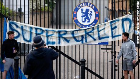 Chelsea fans put up a banner outside Stamford Bridge protesting the Super League.