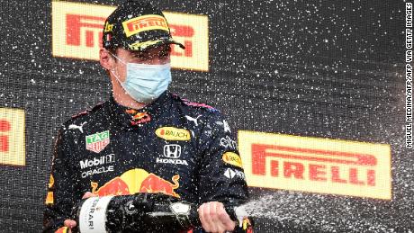 Max Verstappen celebrates after winning the Imola Grand Prix.