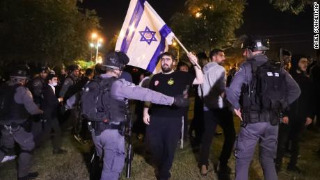 Israeli border police block members of Lehava, a Jewish extremist group, near Damascus Gate amid heightened tensions in the city.