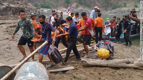 A handout photo made available by Royal Thai Army shows injured fleeing Karen villagers arriving after crossing at a Thai-Myanmar border in Mae Hong Son province, Thailand, 30 March.