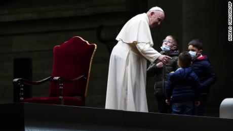 Children flock to Pope Francis during Good Friday service