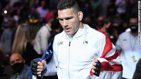 Weidman walks out towards the Octagon prior to facing Hall.