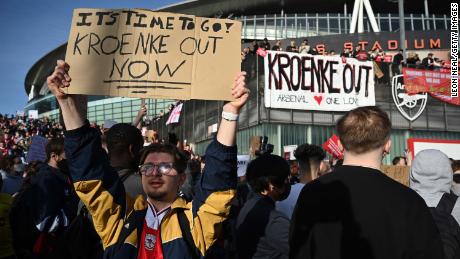 Arsenal fans hold placards during a protest against the club&#39;s owner Stan Kroenke.