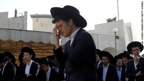 As families bury their dead, recriminations begin over deadly crush at a religious festival in Israel