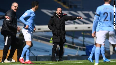 Guardiola gives his team instructions during the Premier League match between Manchester City and Leeds United.