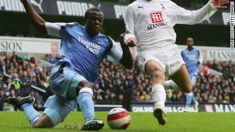 Onuoha battles for the ball in a game between Manchester City and Tottenham.