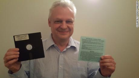 Eddy Willems with his original floppy disc with ransomware from 1989