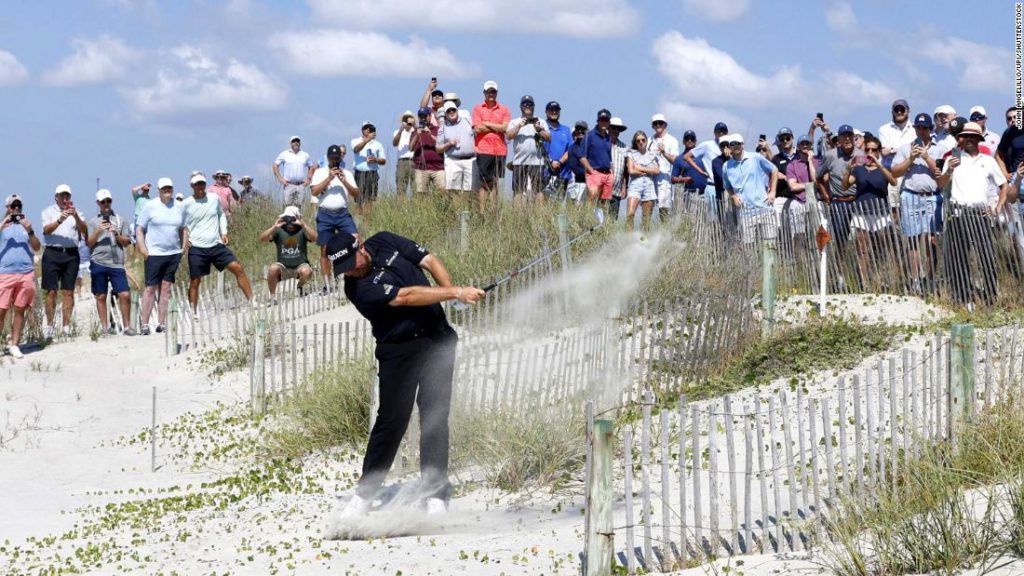 Shane Lowry plays shot from the beach during PGA Championship