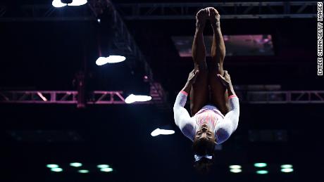Biles holds a pike position as she performs a historic Yurchenko double pike vault.