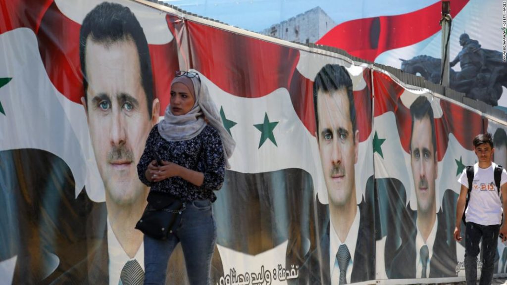 Syrians vote in 'non-event' presidential election set to be won by Assad