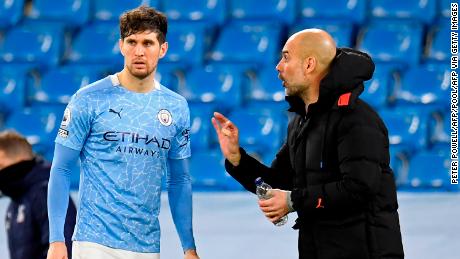 John Stones says Pep Guardiola is &quot;100%&quot; one of the greats.