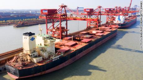 A ship unloading iron ore imported from Australia in Taicang Port in eastern China. 