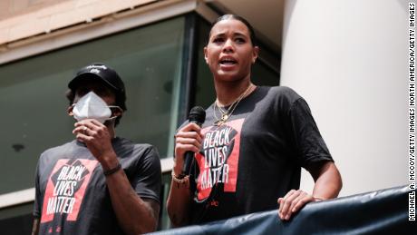 Natasha Cloud and Bradley Beal speak at a Juneteenth rally to raise awareness for social justice issues on June 19, 2020 in Washington, DC.