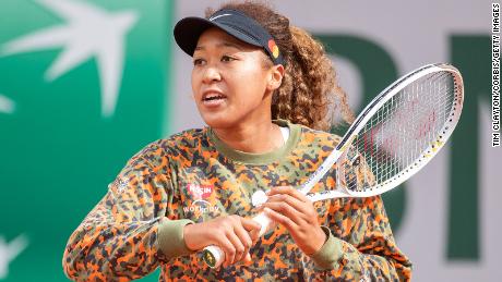 Naomi Osaka of Japan practicing on Court Philippe-Chatrier during a practice match against Ashleigh Barty of Australia  in preparation for the French Open at Roland Garros.