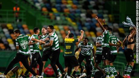Sporting Lisbon players celebrate after winning the title. 