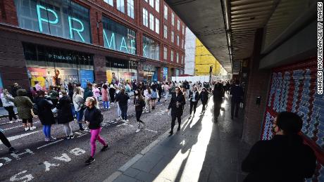 Thousands of shoppers wait for Primark to open for the first time since the latest lockdown on April 30, 2021 in Belfast, Northern Ireland. 