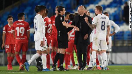 Zidane interacts with referee Juan Martinez Munuera after the La Liga match between Real Madrid and Sevilla.
