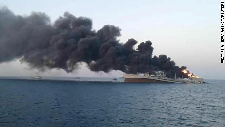 Smoke rises from the stricken navy ship &#39;Khark&#39; off the Iranian port of Jask.