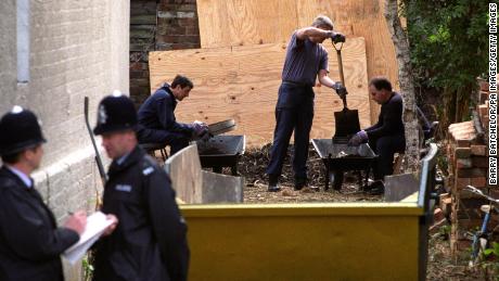 Police sift through soil as they search for clues in the Fred West murder cases in the garden of 25 Midland Road, Gloucester, on April 27, 1994.