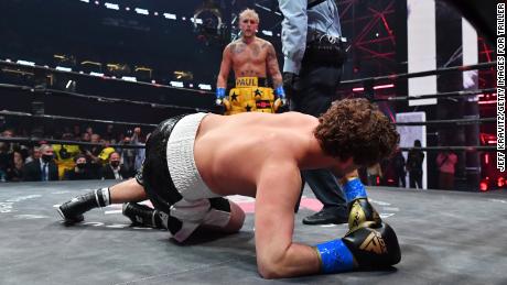 Jake Paul stands over Ben Askren after knocking down the former MMA fighter.