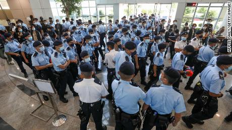 Police officers raid  the Apple Daily office on June 17 in Hong Kong.