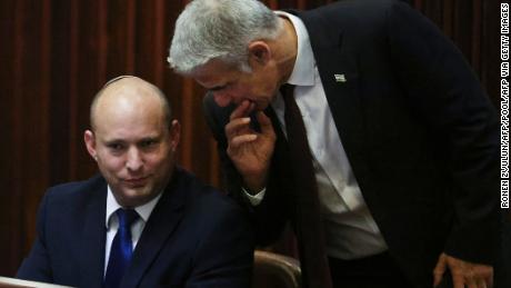Right-wing Bennett described centrist Yair Lapid (R), his new coalition partner, as his &quot;friend.&quot;  