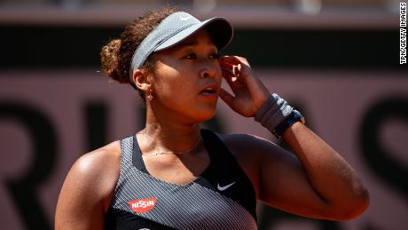 Osaka looks to her team during her match against Patricia Maria Țig at Roland Garros.
