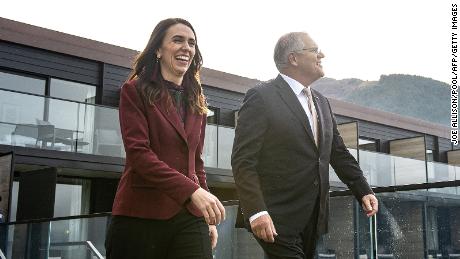 New Zealand&#39;s Prime Minister Jacinda Ardern walks with Australia&#39;s Prime Minister Scott Morrison ahead of the Australia-New Zealand Leaders&#39; Meeting in Queenstown on May 31, 2021. 