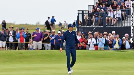 Spieth reacts after making his birdie putt on the 15th green during his first round of The Open.