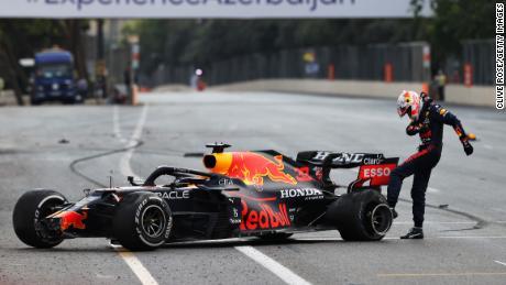 Max Verstappen kicks his tire after crashing out in Azerbaijan.