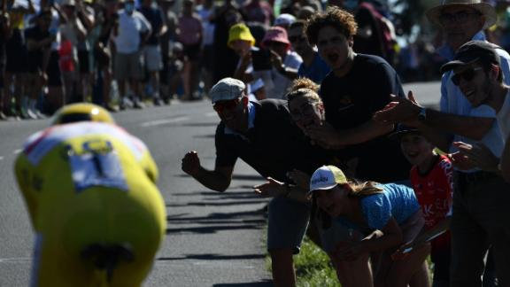 Spectators cheer on Pogacar during the 20th stage of the 108th edition of the Tour de France cycling race.