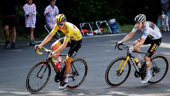 Pogacar rides ahead of Team Jumbo Visma's Jonas Vingegaard of Denmark during the 18th stage between Pau and Luz Ardiden, on July 15, 2021.