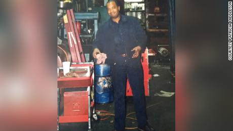 Middleton&#39;s father, Kevin Wayne Middleton Sr., works in his auto repair shop in the 1990s.