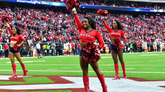 Biles performs with the Houston Texans cheerleaders in December 2017.