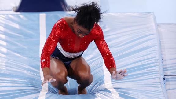 Biles stumbles on her vault landing while competing in the team all-around at the Tokyo Olympics in July 2021. Biles then <a href=