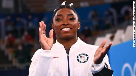 Simone Biles applauds during the artistic gymnastics women&#39;s team final during the 2020 Olympic Games.